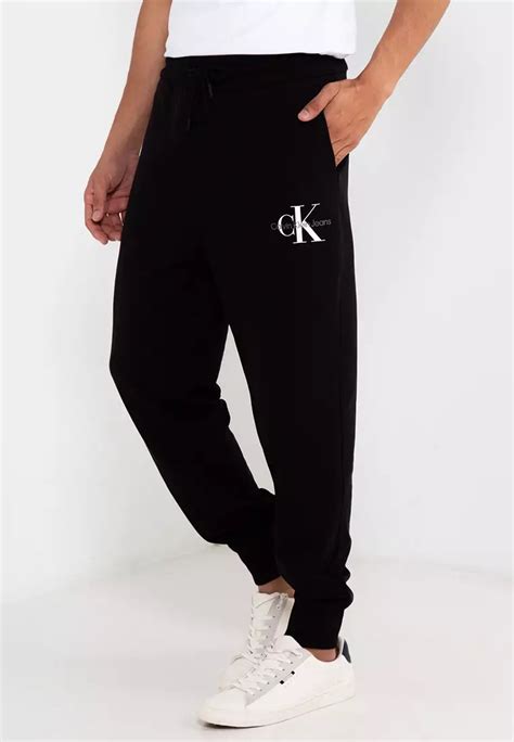 calvin klein logo pants|More.